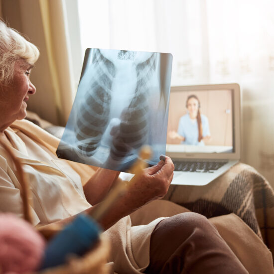 Women holding chest x-ray