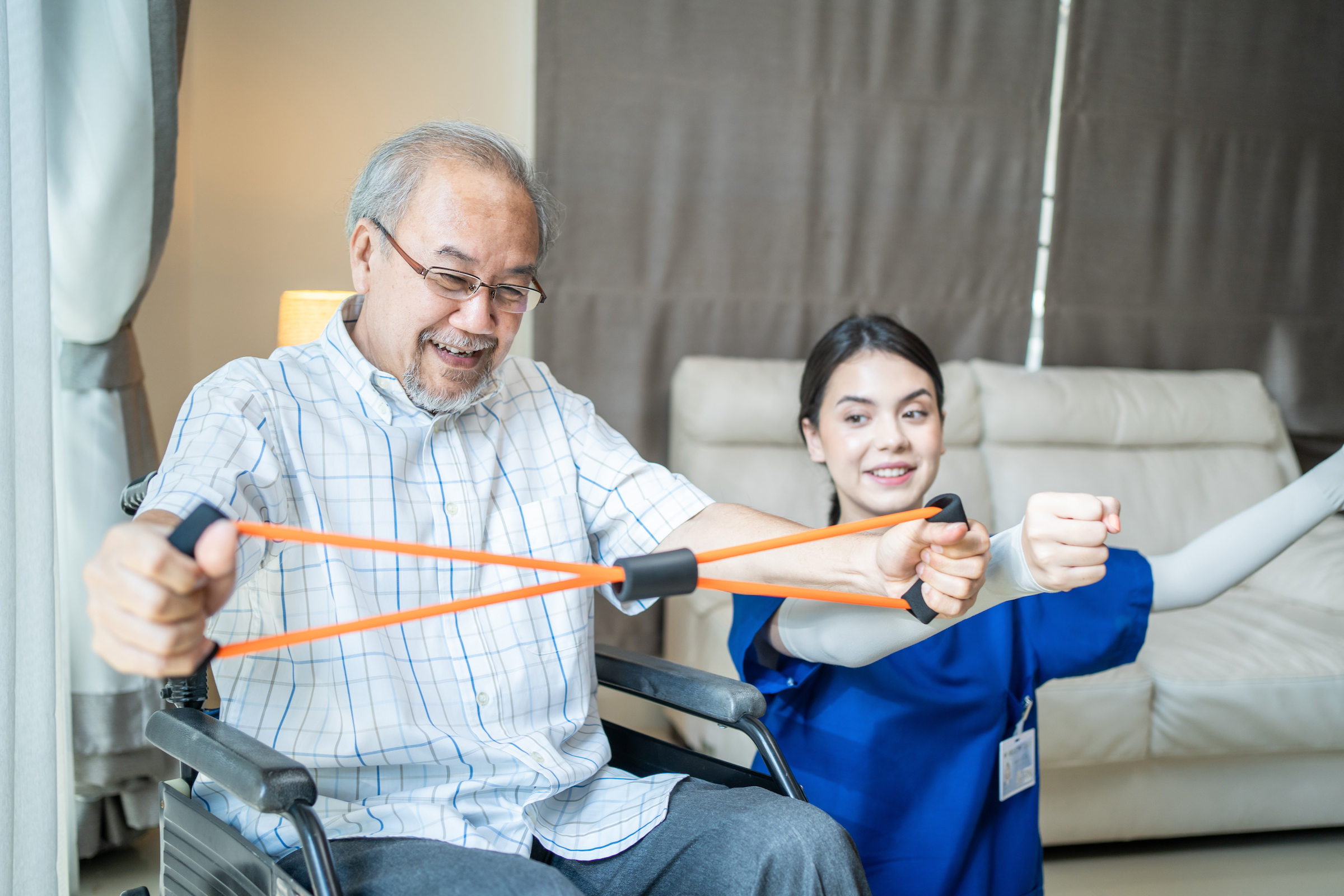 Man in Wheelchair doing exercises with a therapist